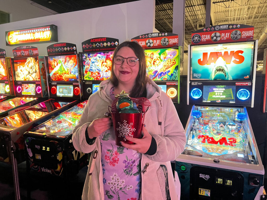 Mary holding her prize for most donations in December