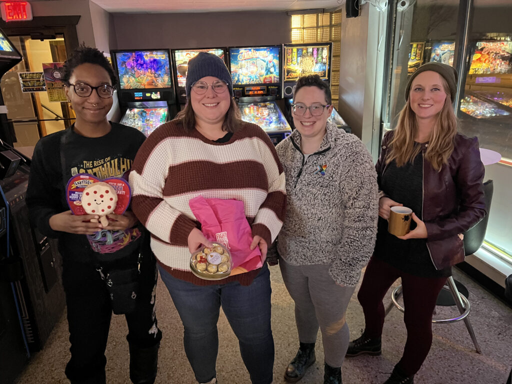 Winners at Aftershock Arcade holding prizes